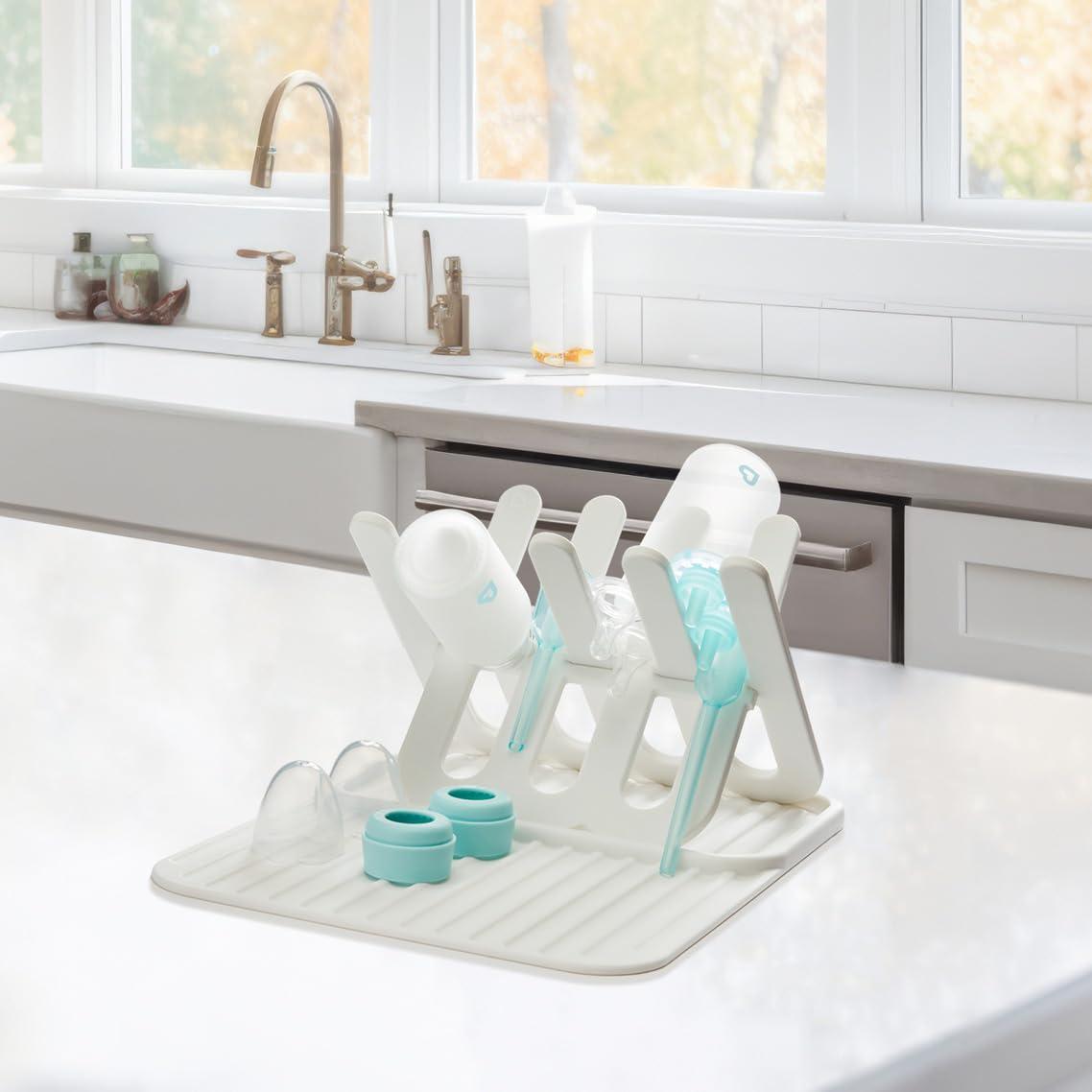 imageMunchkin Bottle Drying Rack and Mat Holds 8 Bottles Pump Parts Pacifiers ampamp Accessories Space Saving Folding Design Home and Travel Use Silicone White