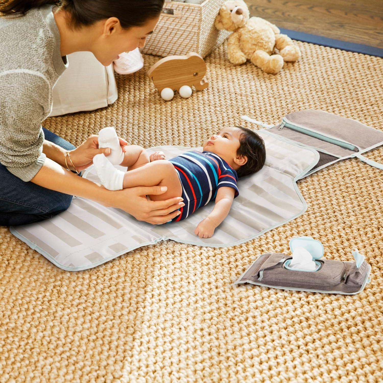 imageMunchkin Portable Changing Pad  Lightweight and Compact Baby Diaper Changing Mat with SilverIon Technology Includes 12 Diaper Disposal Bags Grey